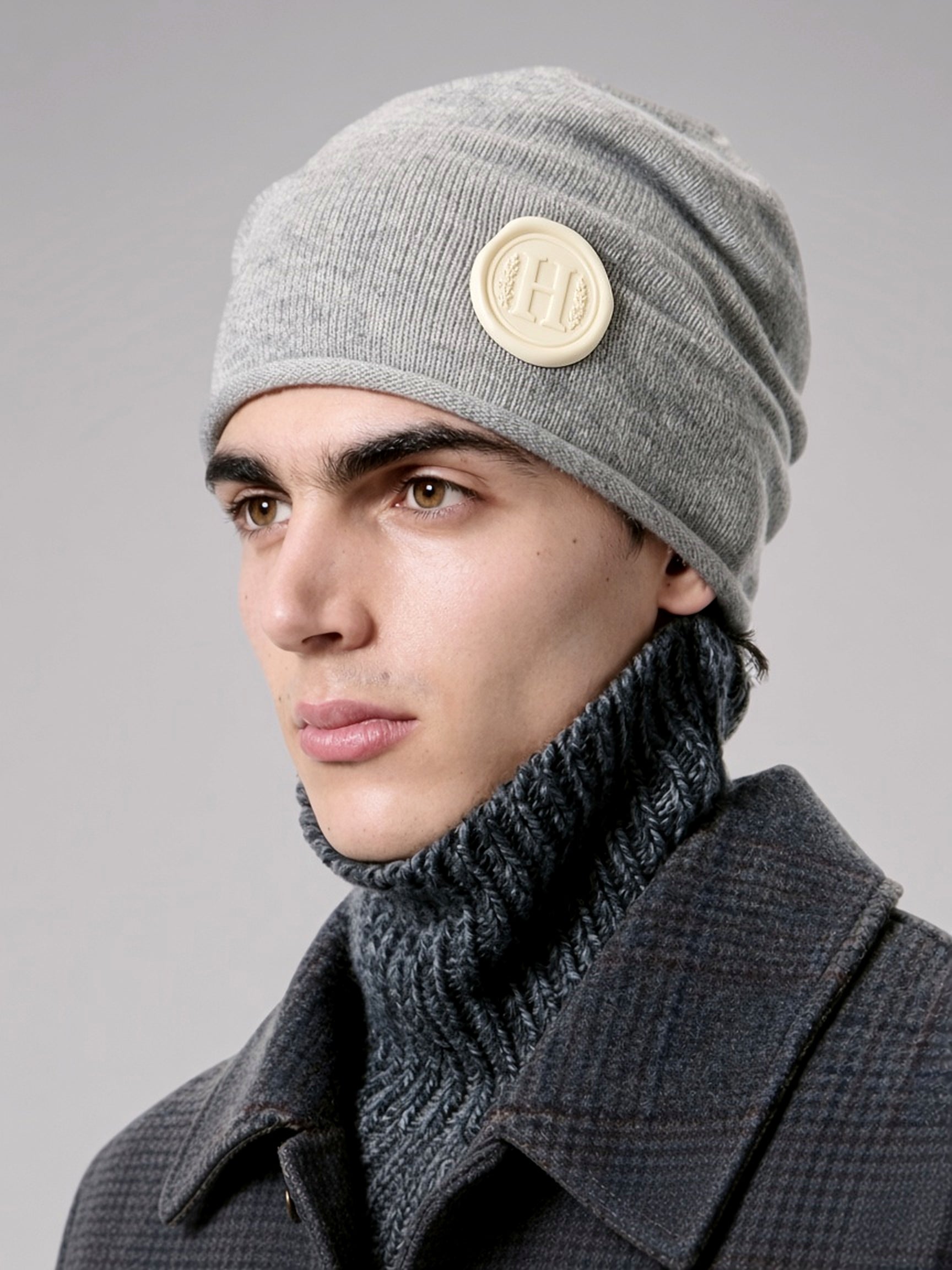 Letter Seal Beanie — studio portrait, wax-seal H